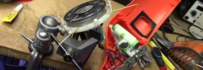 Vacuum cleaner repair parts and tools on a workbench in Grand Rapids, MI